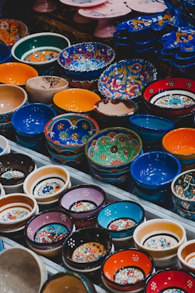 assorted color bowls on white plastic container