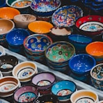assorted color bowls on white plastic container