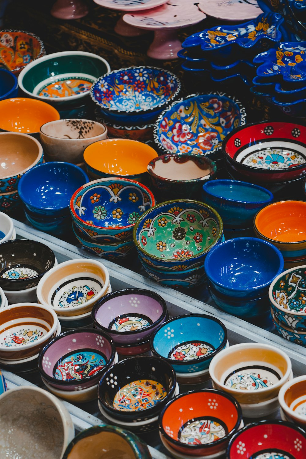 assorted color bowls on white plastic container