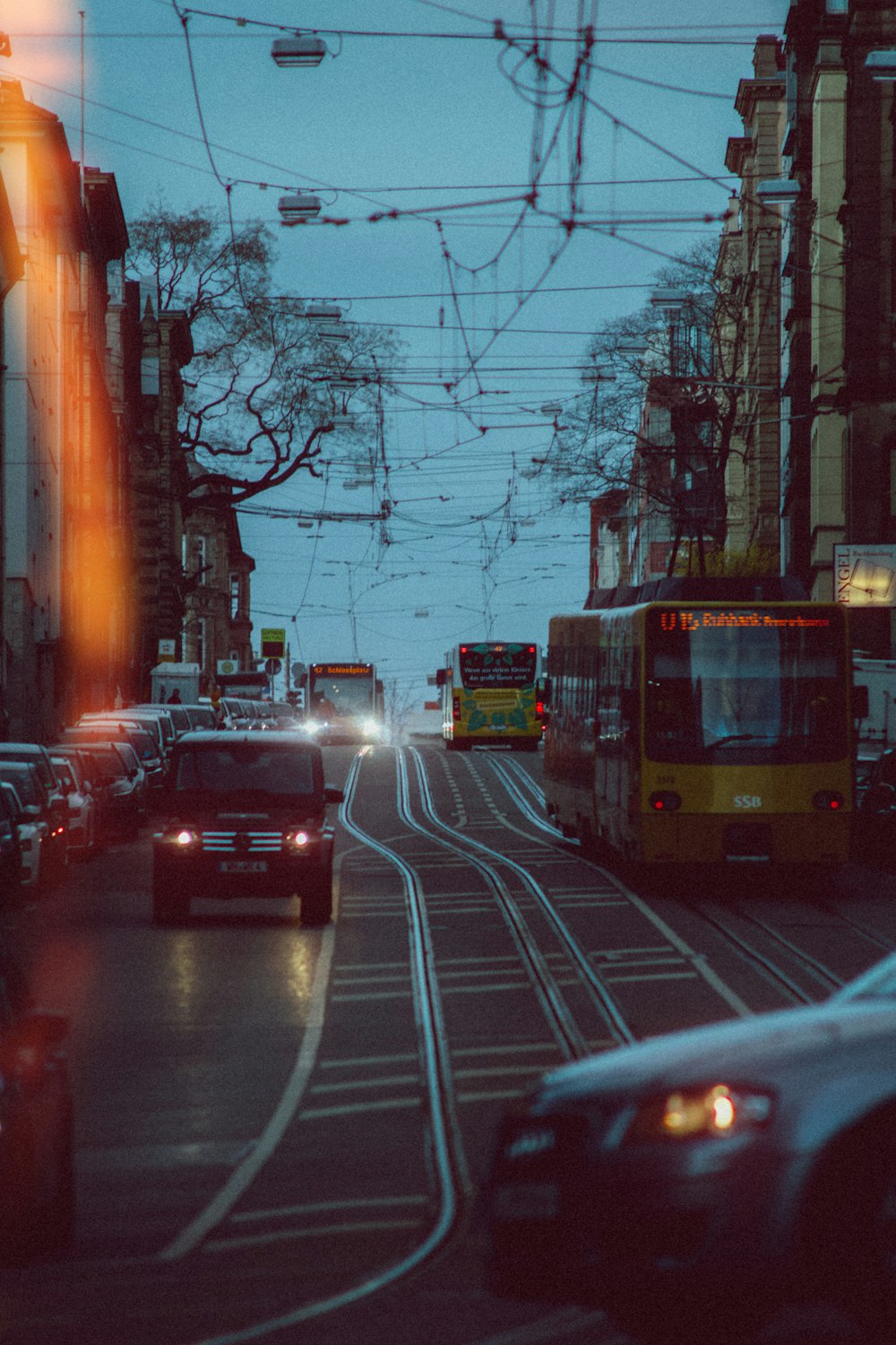 red and white tram on road during daytime