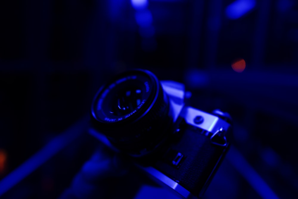 black and silver camera on table