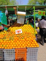 Stack of oranges and lemons ready for customers at Arceo Greens stall.
