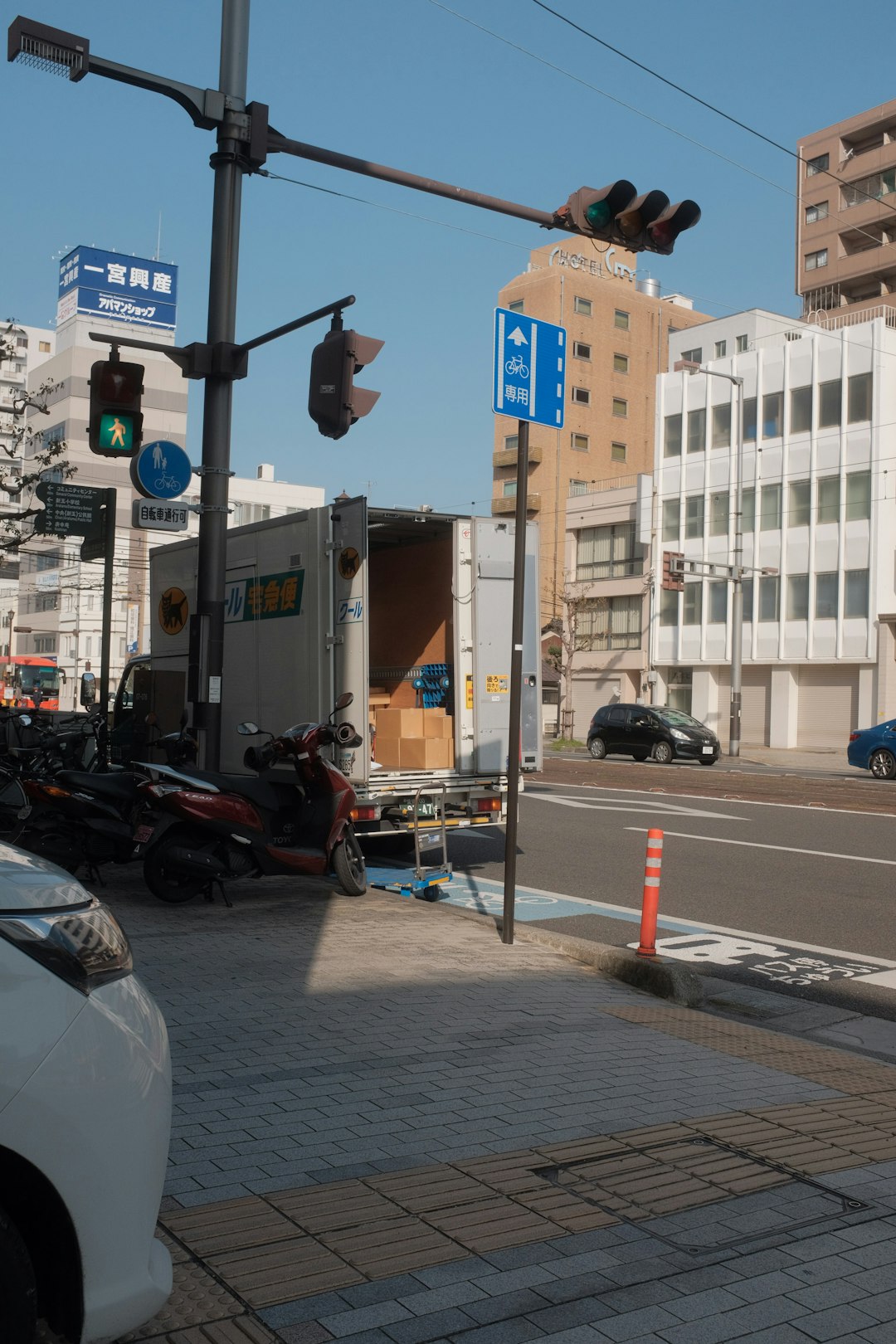 cars parked on side of the road during daytime