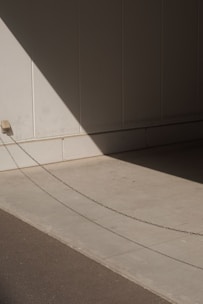 white concrete staircase near gray wall