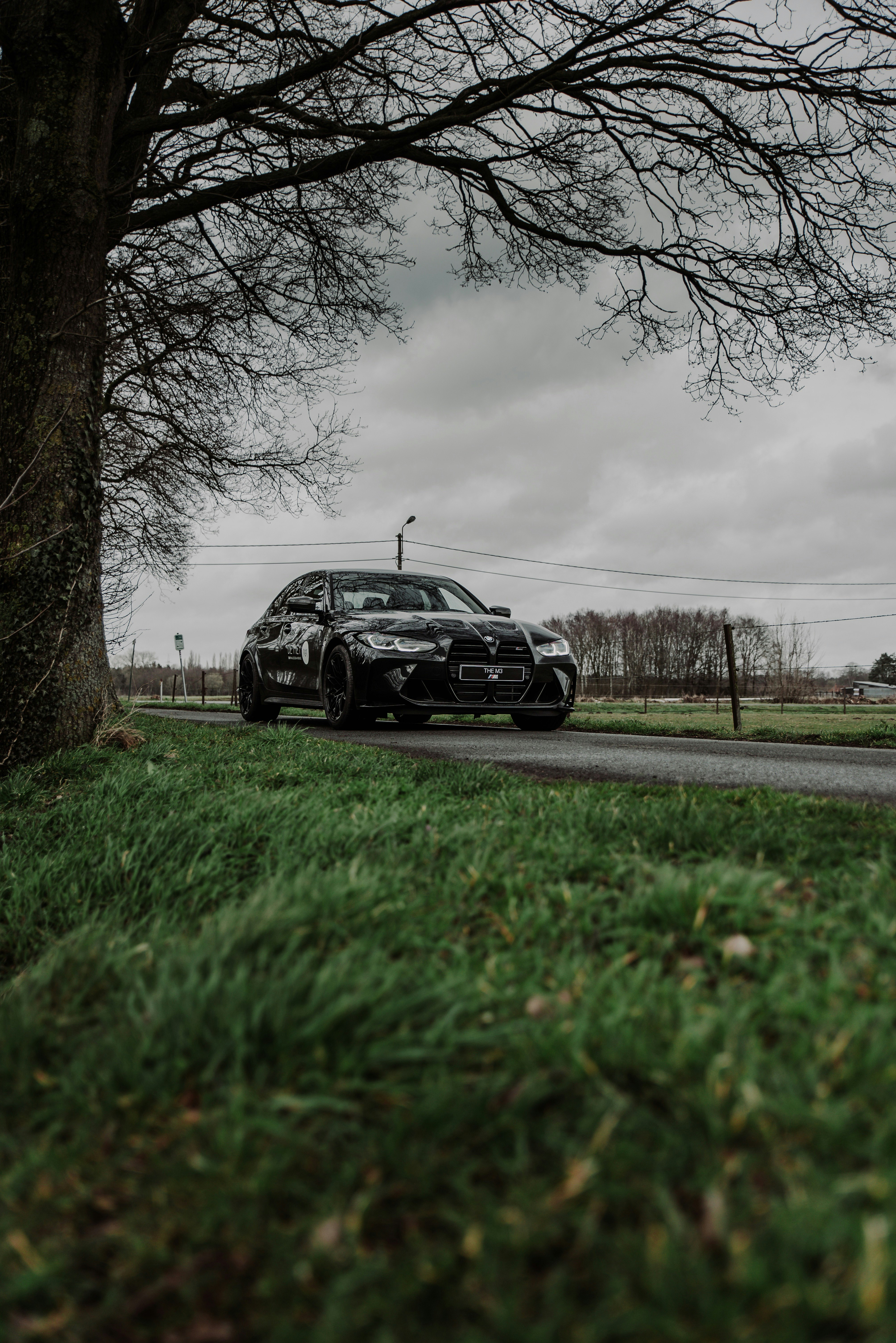 black car on road during daytime