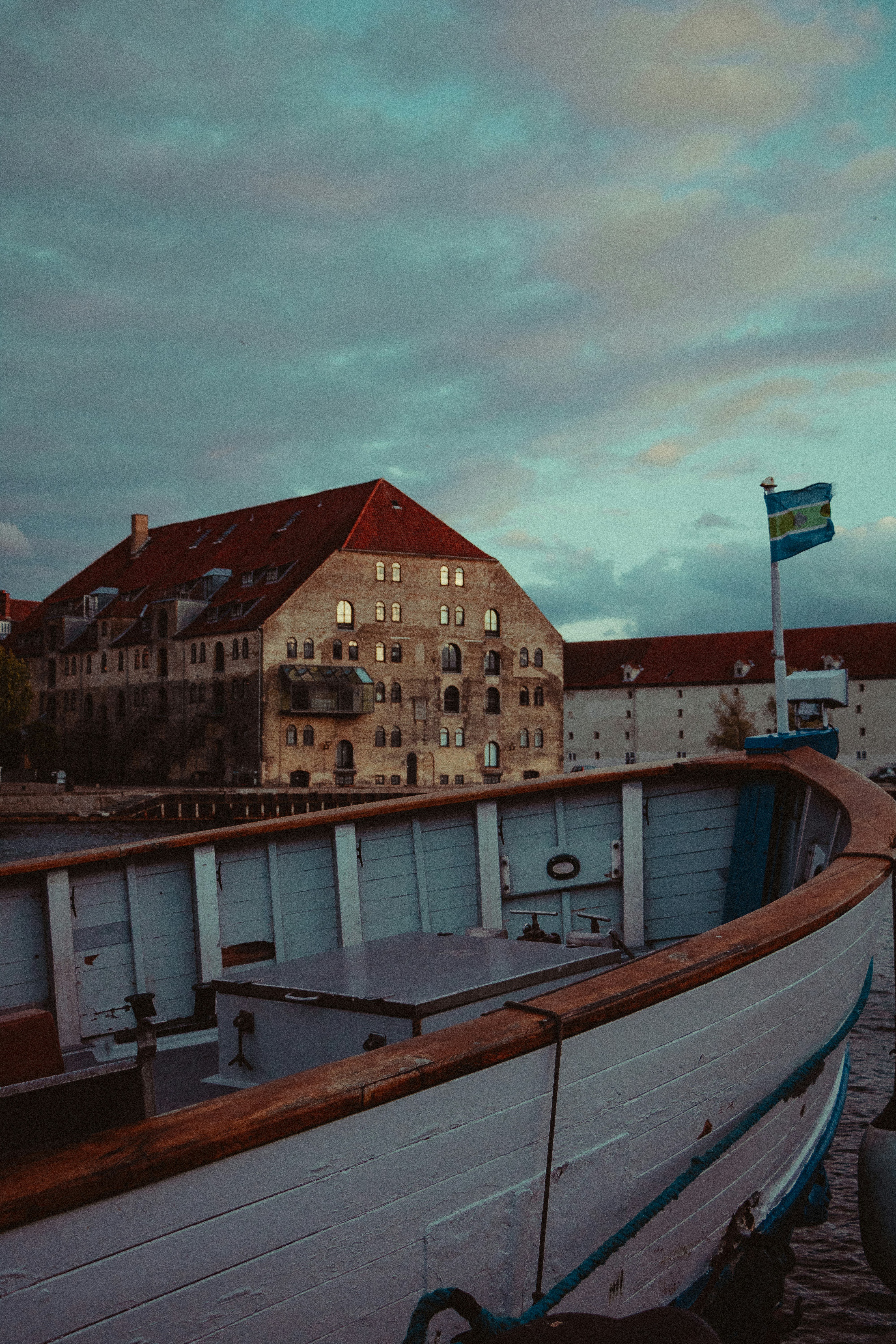 white and brown boat on dock during daytime