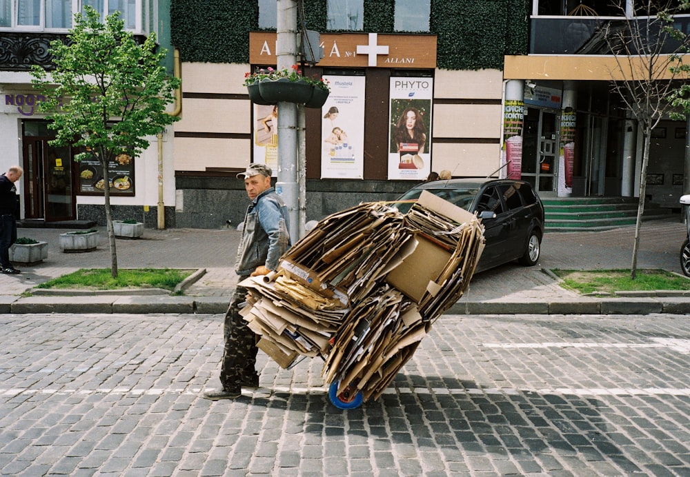 man in blue denim jacket carrying brown woven basket