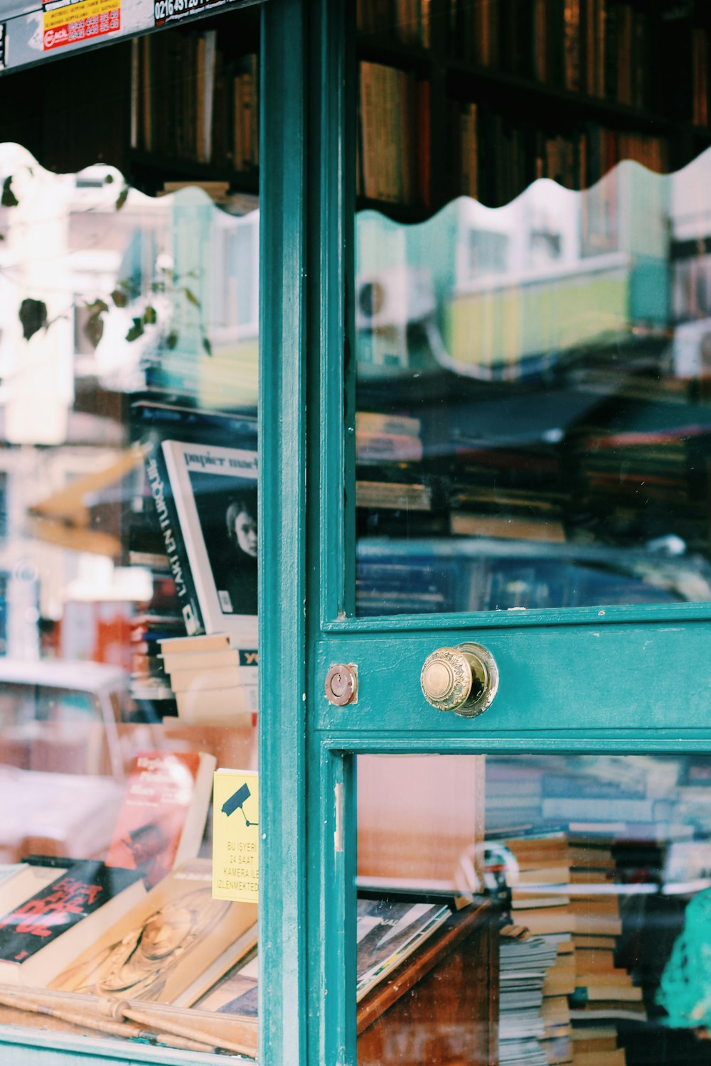 green wooden framed glass door