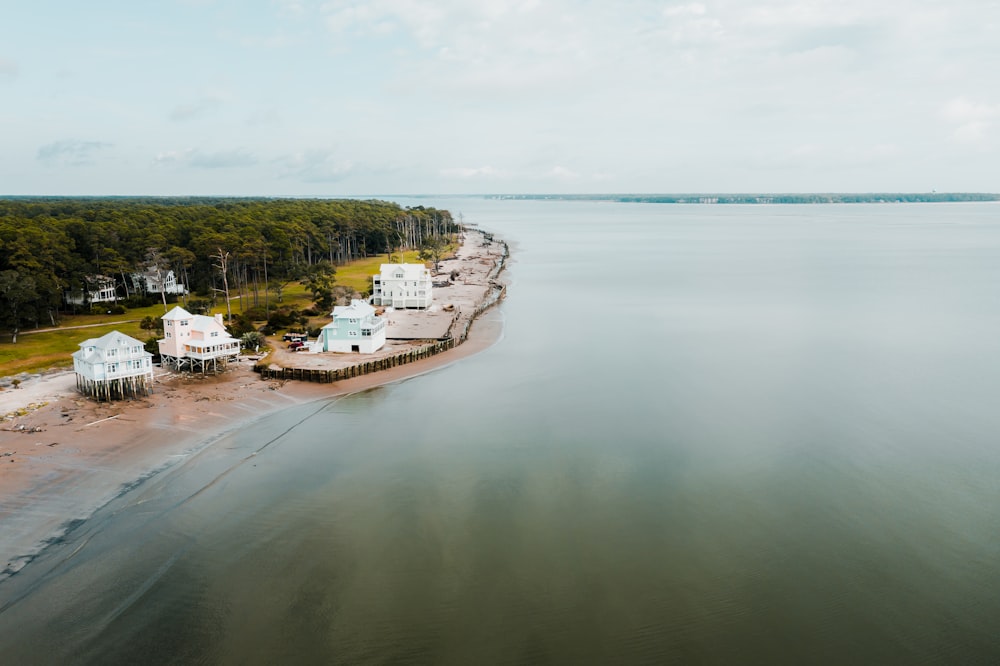 white and brown house on island surrounded by body of water