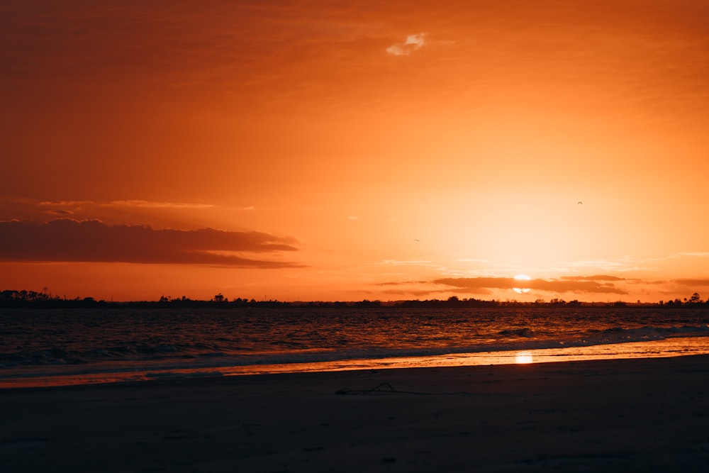 body of water during sunset