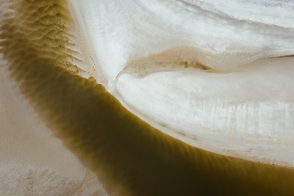 an aerial view of a river with water flowing over it