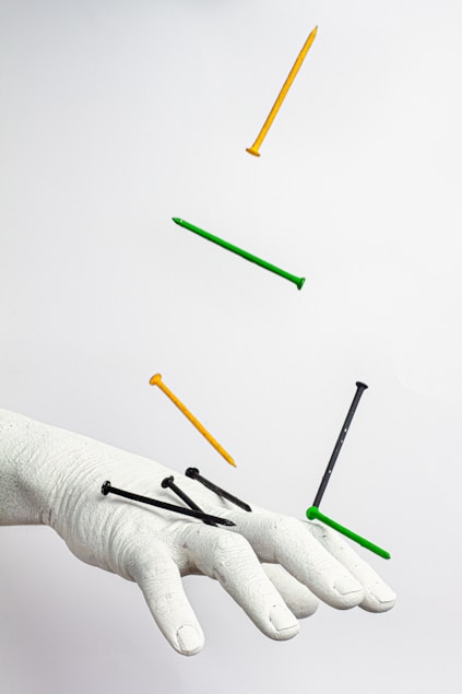 person holding green color pencil