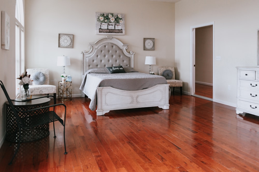 white bed near brown wooden table