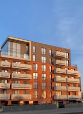 brown concrete building under blue sky during daytime