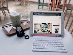 A cozy cafe owner reviewing sales charts on a tablet.