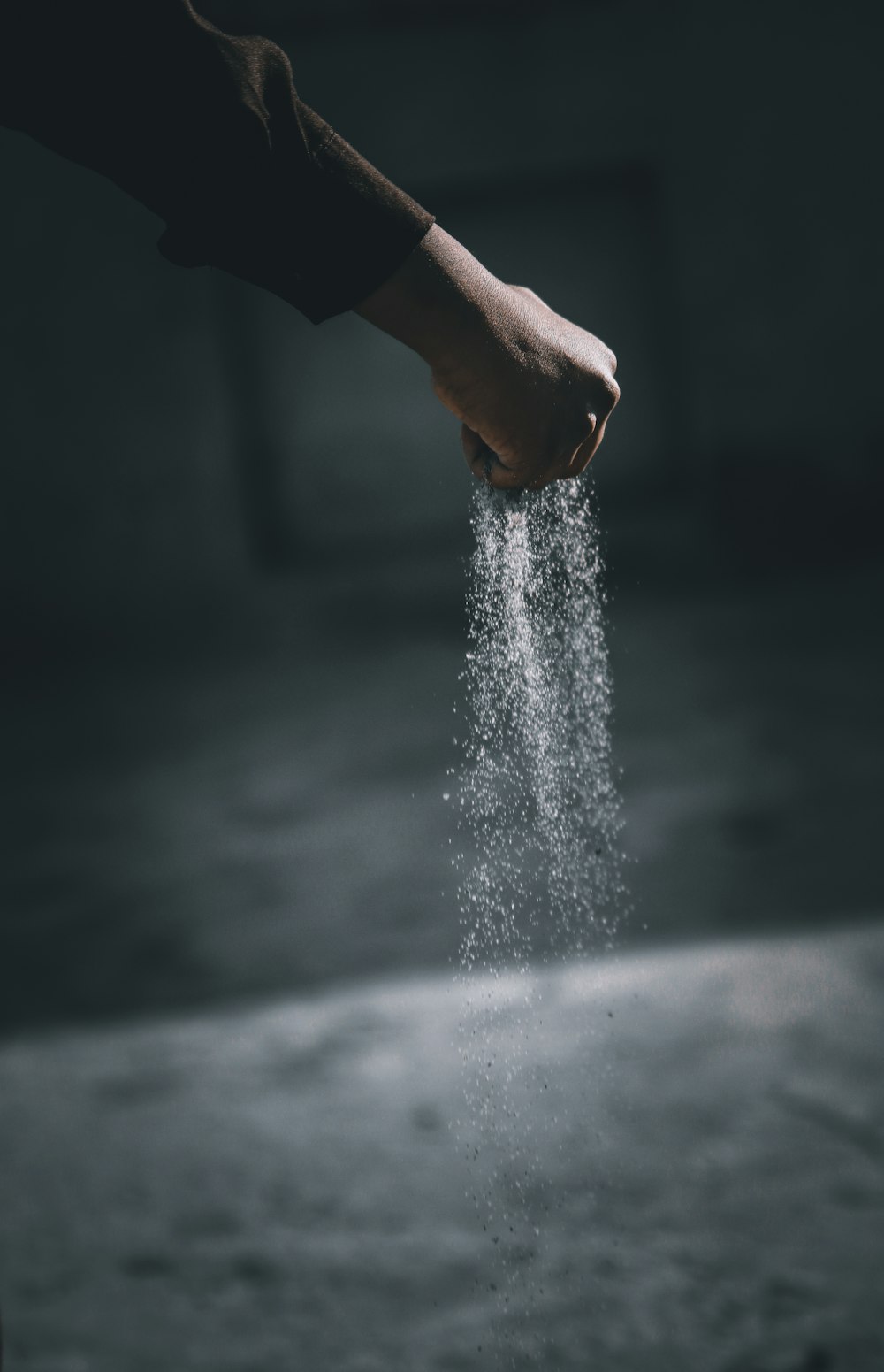 person pouring water on water