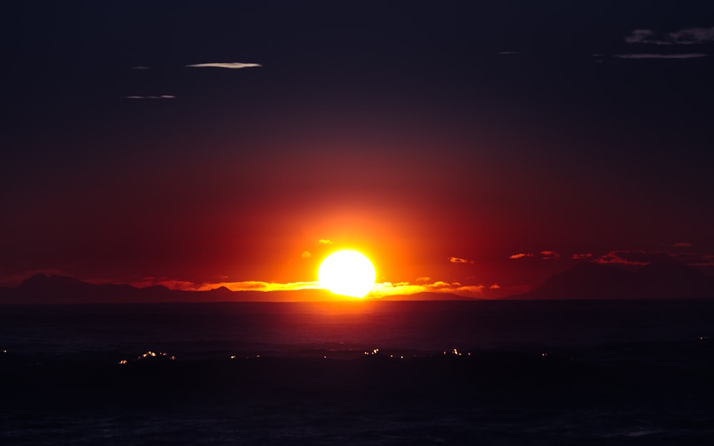 body of water during sunset