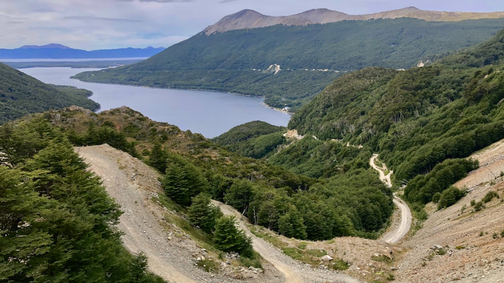 green mountains near body of water during daytime