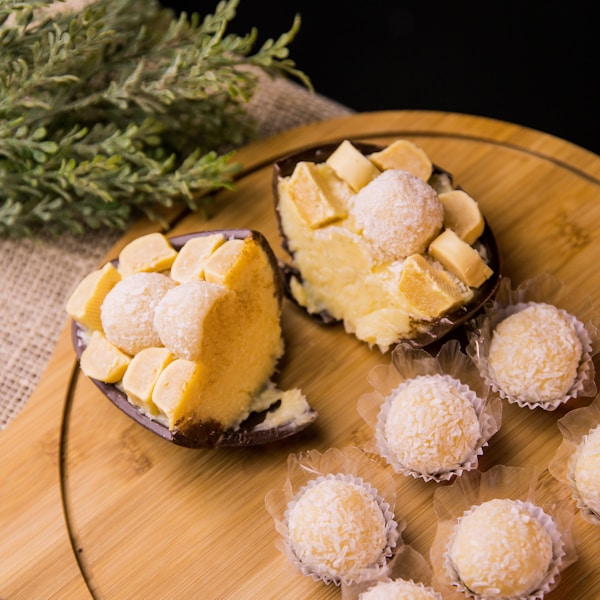 sliced cheese on brown wooden round plate