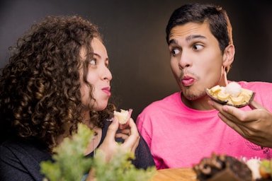 photography poses for dining,how to photograph woman in pink crew neck shirt beside man in yellow crew neck shirt