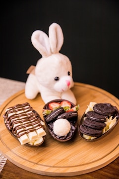white rabbit plush toy on brown wooden table
