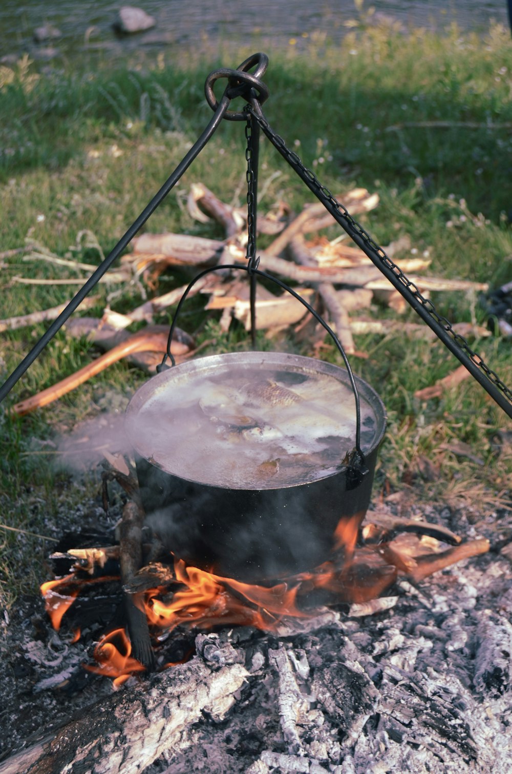 black cooking pot on fire