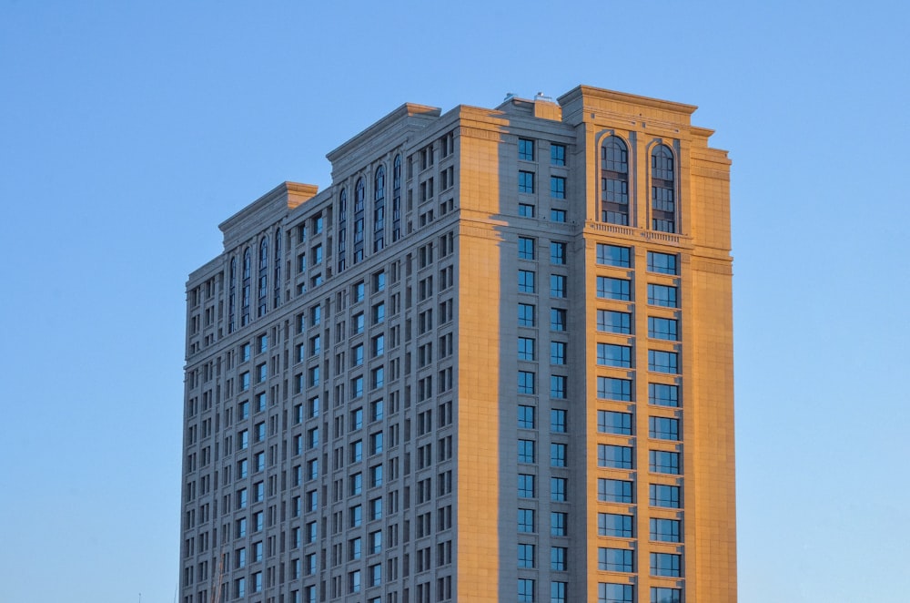 brown concrete building under blue sky during daytime