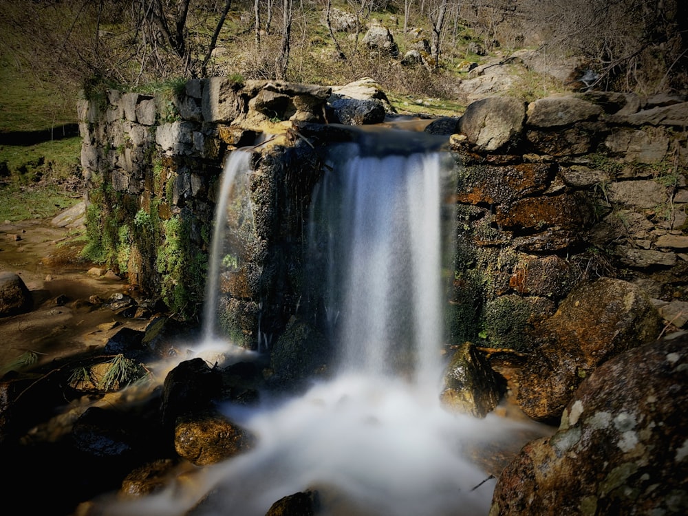 waterfalls in the middle of the woods