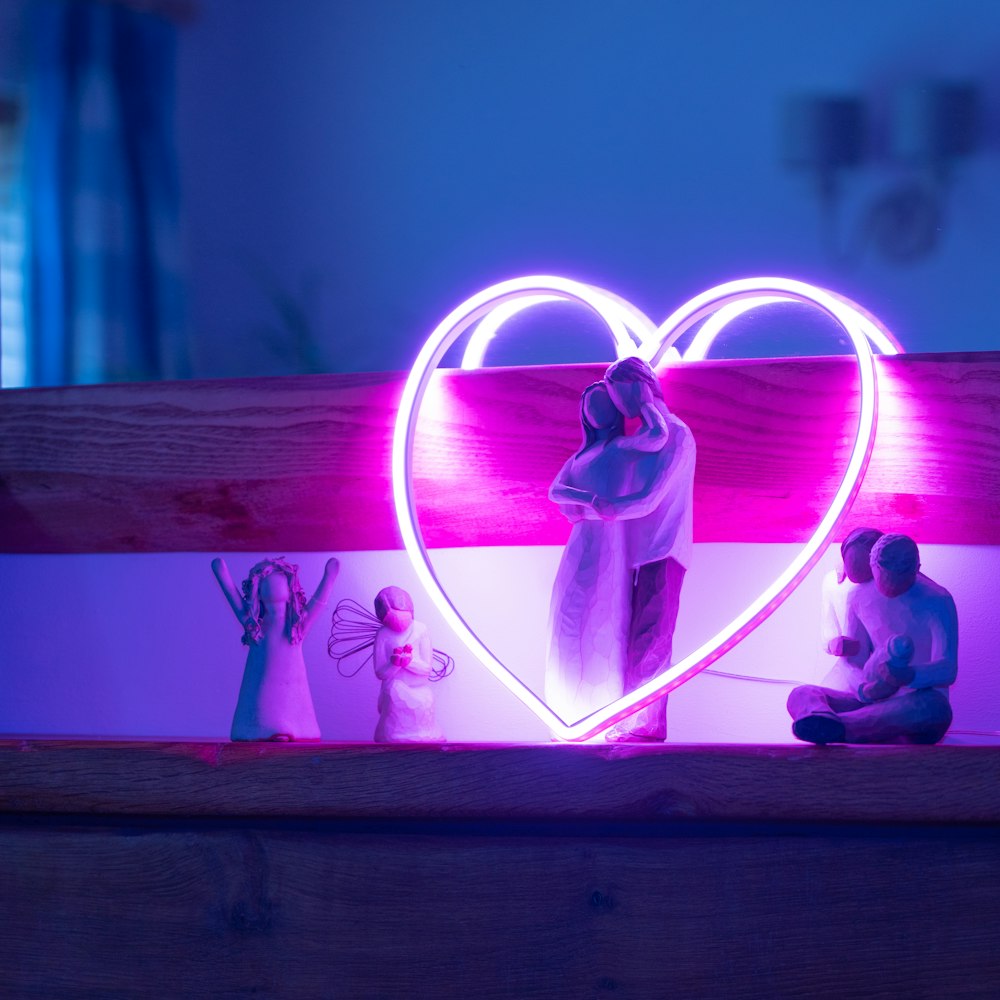 purple heart shaped light on brown wooden table