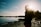 man in black jacket standing near lake during daytime