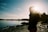 man in black jacket standing near lake during daytime