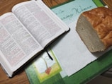Colorful craft materials and Bible verses spread out on a table.