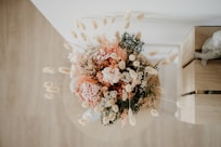 pink and white flowers on white textile