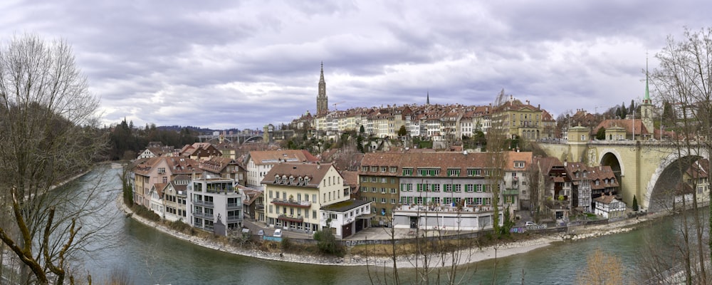 brown and white concrete buildings near body of water during daytime