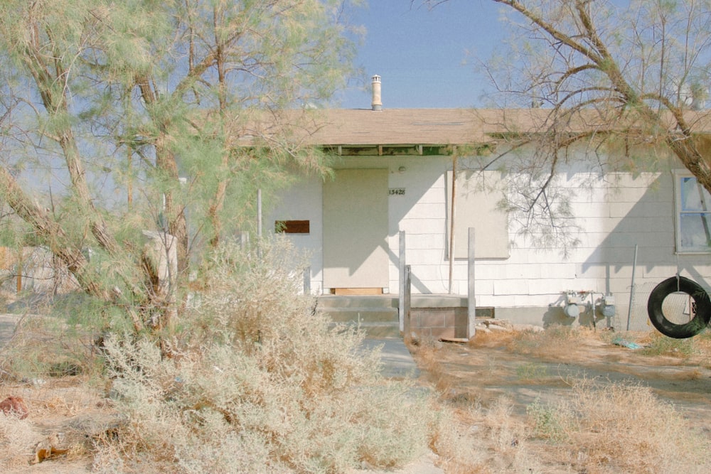 white concrete building near trees during daytime