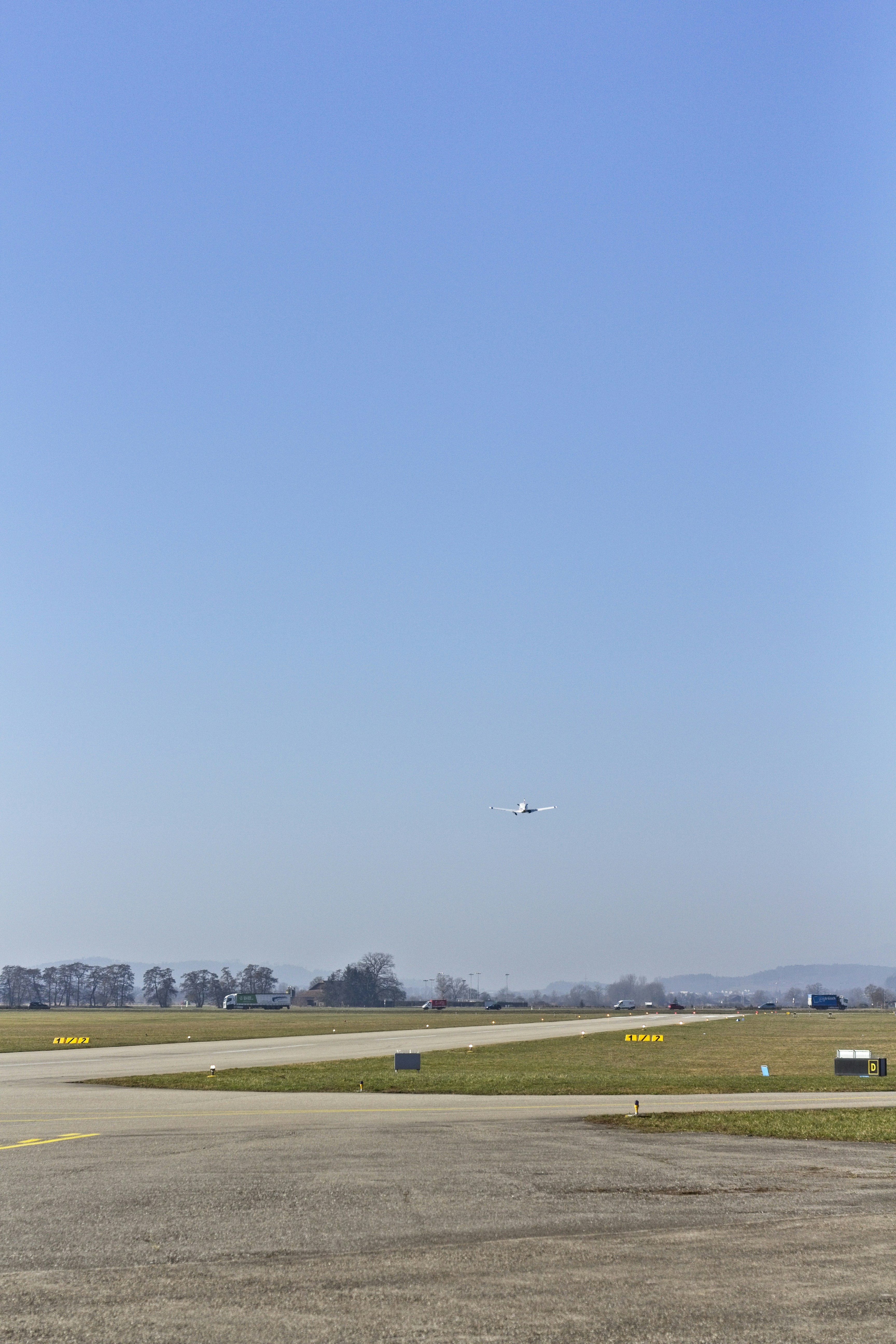 green grass field under blue sky during daytime