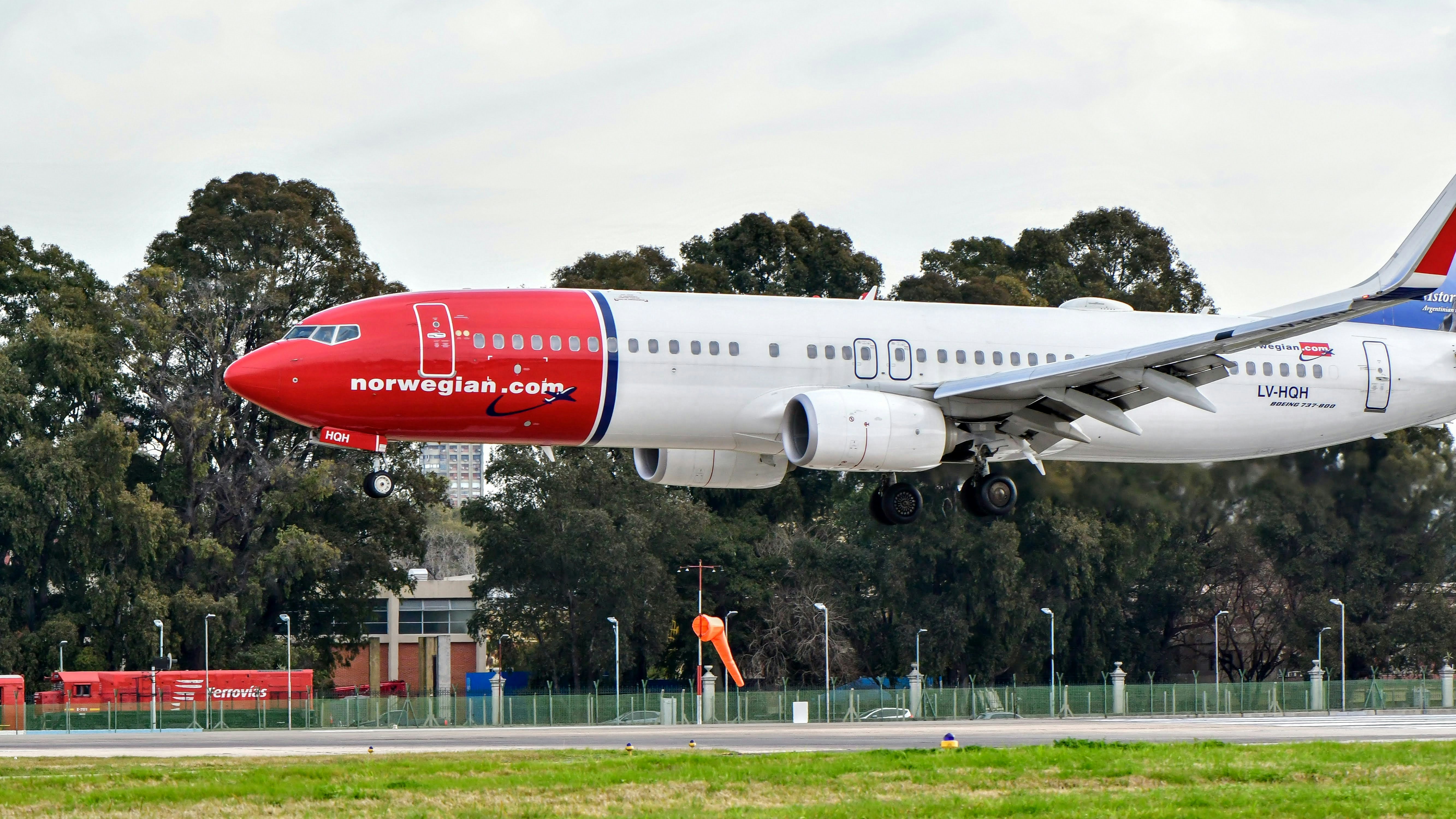 white and red passenger plane on airport during daytime, 