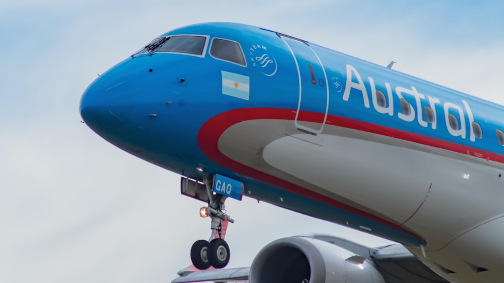 blue and red passenger plane