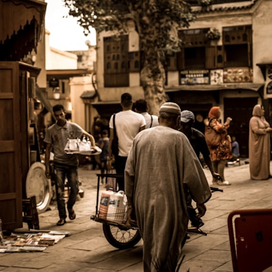 Group of Indian Navy veterans exploring a vibrant Chinese market street.