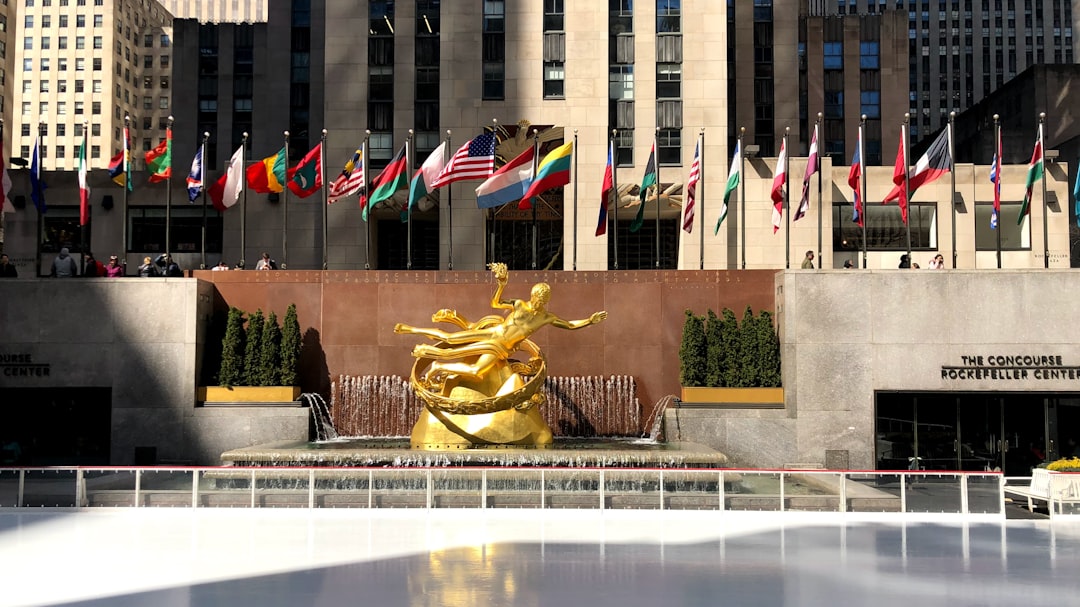 gold dragon statue near green plants,