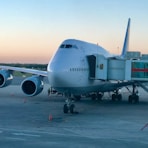 white and black airplane on airport during daytime