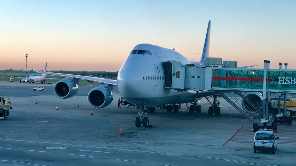 white and black airplane on airport during daytime