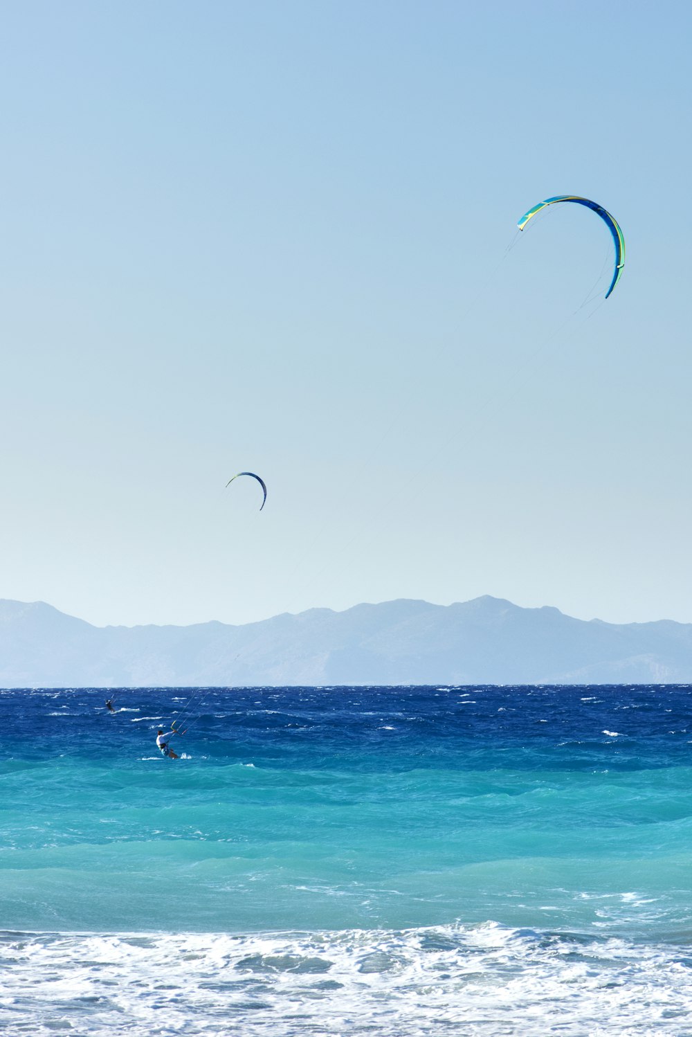 people surfing on sea during daytime