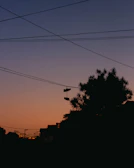 Sneaker silhouette against a sunset skyline, capturing city vibes.