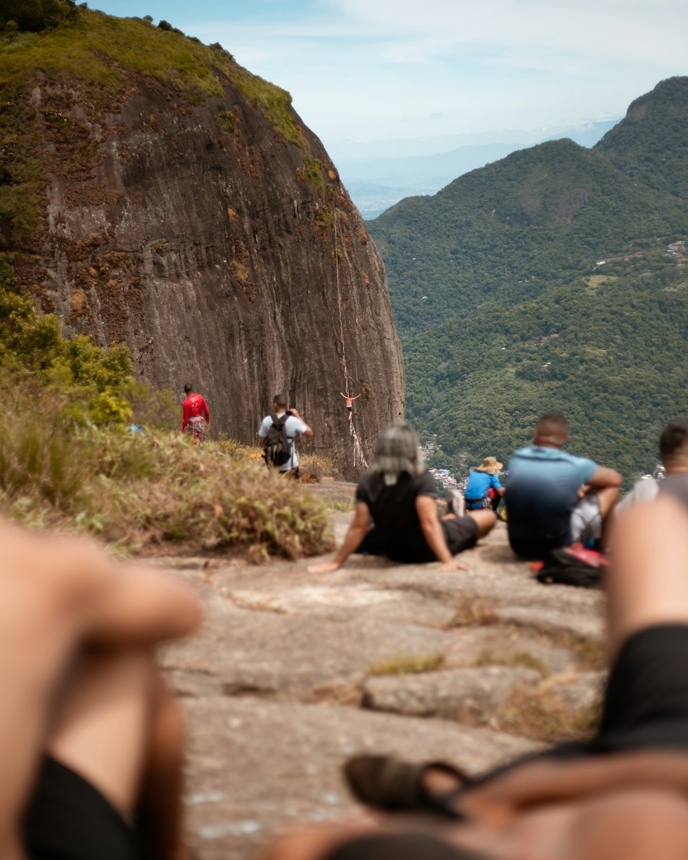 people climbing mountain during daytime