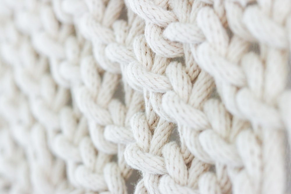 white knit textile on brown wooden table