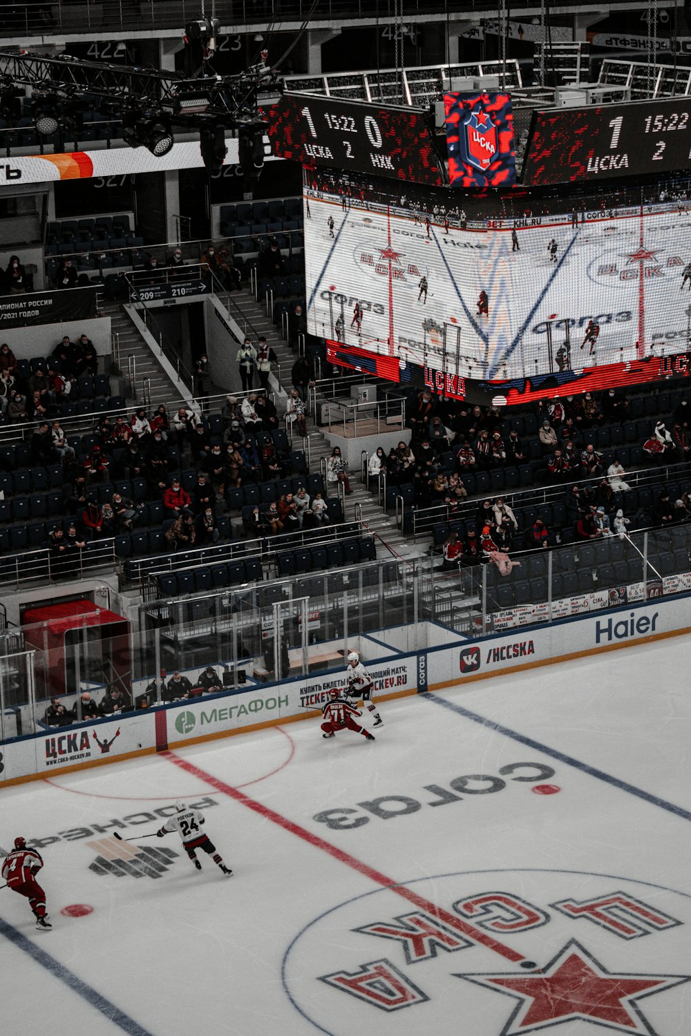 people playing ice hockey inside stadium