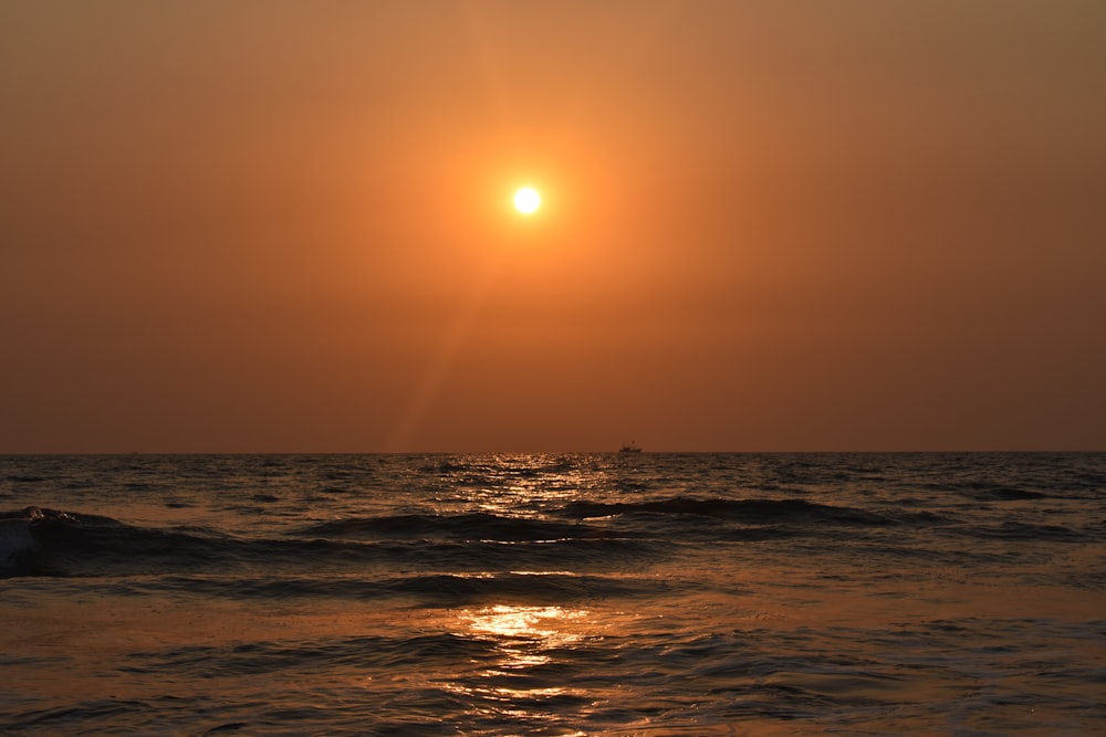 body of water during sunset