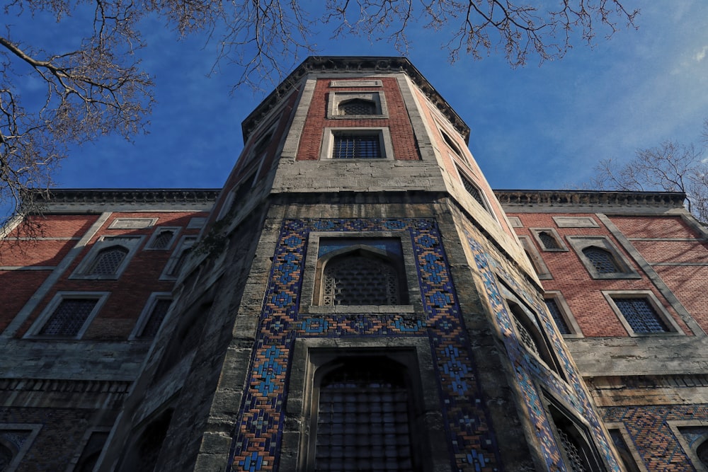 brown brick building under blue sky during daytime