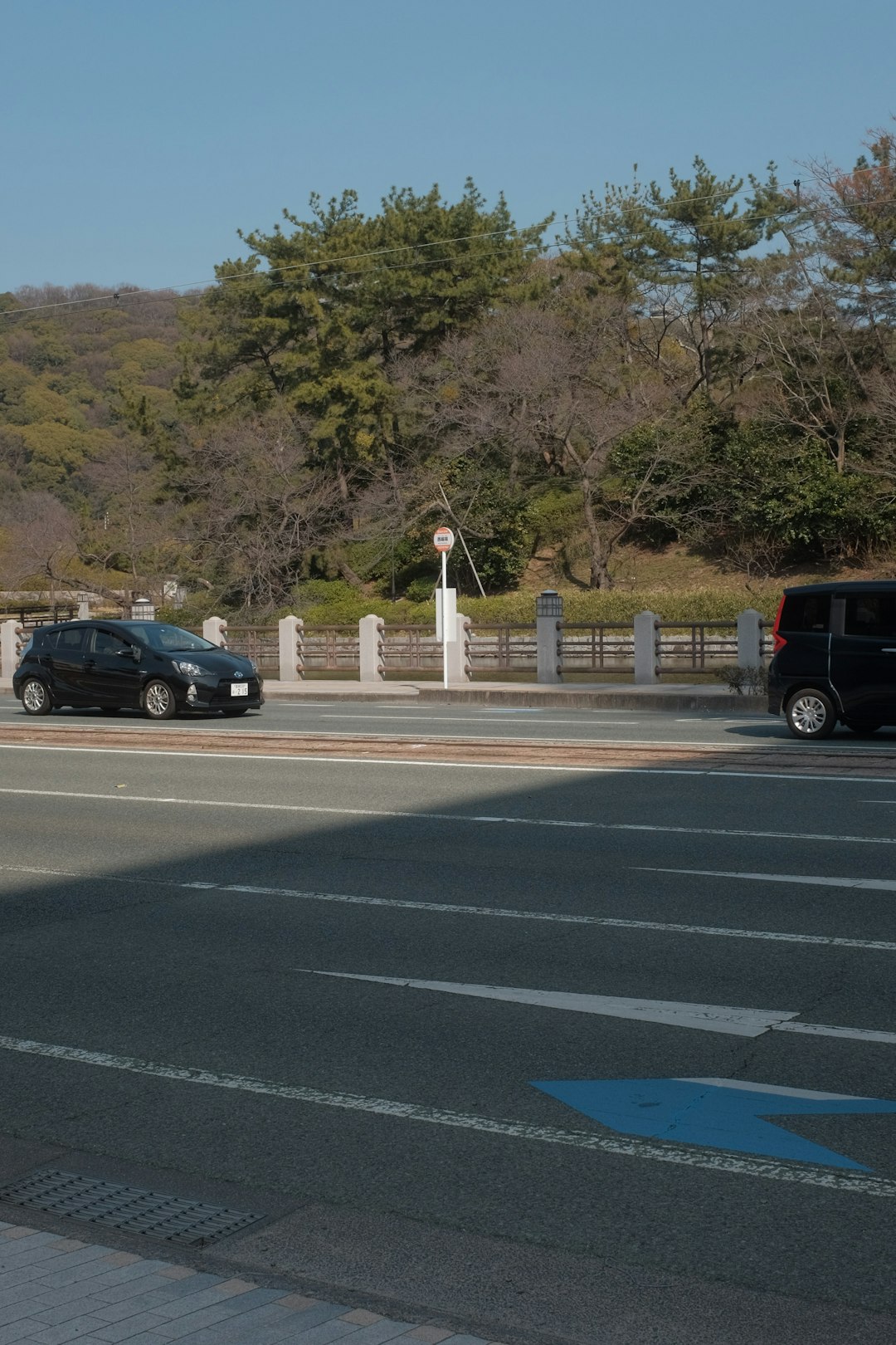 black sedan on road during daytime